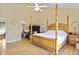 Main bedroom with high ceiling, wood floors, and a large bed at 5340 Cobblestone Ct, Wesley Chapel, FL 33543