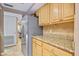 Bright kitchen features granite countertops and light wood cabinets at 5340 Cobblestone Ct, Wesley Chapel, FL 33543