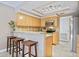 Well-equipped kitchen with light wood cabinets and granite counters at 5340 Cobblestone Ct, Wesley Chapel, FL 33543