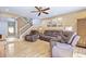 Relaxing living room with hardwood floors, staircase and large windows at 5340 Cobblestone Ct, Wesley Chapel, FL 33543