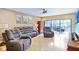 Spacious living room with recliner chairs and hardwood floors at 5340 Cobblestone Ct, Wesley Chapel, FL 33543