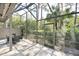 Private screened patio overlooking a lush, green landscape at 5340 Cobblestone Ct, Wesley Chapel, FL 33543
