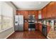 Modern kitchen with stainless steel appliances and wood cabinets at 535 52Nd N Ave, St Petersburg, FL 33703