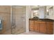 Bathroom boasts a walk-in shower and granite vanity at 5571 Rock Dove Dr, Sarasota, FL 34241