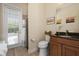 Spa-like bathroom with walk-in shower, granite vanity, and private access at 5571 Rock Dove Dr, Sarasota, FL 34241