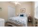 Guest bedroom with a full-size bed and updated decor at 5571 Rock Dove Dr, Sarasota, FL 34241
