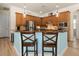 Modern kitchen with light wood cabinets and granite countertops at 5571 Rock Dove Dr, Sarasota, FL 34241