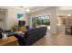 Living room with black leather couches and pool access at 5571 Rock Dove Dr, Sarasota, FL 34241