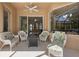 Covered patio with wicker furniture and fire pit at 5571 Rock Dove Dr, Sarasota, FL 34241