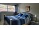 Cozy bedroom featuring natural light and a comfortable blue striped comforter at 5880 38Th N Ave # 204, St Petersburg, FL 33710