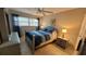 Bedroom with neutral colors, tile floors, and a large window at 5880 38Th N Ave # 204, St Petersburg, FL 33710