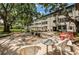 A comfortable outdoor seating area is provided for residents beneath the shade of mature oak trees at 5880 38Th N Ave # 204, St Petersburg, FL 33710
