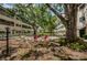 An outdoor patio is shaded by mature oak trees, and ample seating options are available for residents and guests at 5880 38Th N Ave # 204, St Petersburg, FL 33710