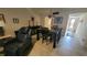 Dining room with neutral walls, tile floors, furniture and stylish lighting at 5880 38Th N Ave # 204, St Petersburg, FL 33710
