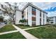 Exterior view of the building with brickwork and a well-maintained lawn at 5880 38Th N Ave # 204, St Petersburg, FL 33710