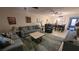 Spacious living room flowing into the dining area with modern furnishings and decor at 5880 38Th N Ave # 204, St Petersburg, FL 33710