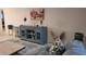 Living room showcasing a decorative cabinet, modern art, and comfortable seating at 5880 38Th N Ave # 204, St Petersburg, FL 33710