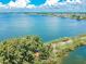 Aerial view of waterfront area with lush vegetation and homes at 5915 Sea Ranch Dr # 308W, Hudson, FL 34667