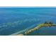 Aerial view of calm water with small island and boat at 5915 Sea Ranch Dr # 308W, Hudson, FL 34667