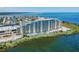 Aerial view of waterfront condo building with water access at 5915 Sea Ranch Dr # 308W, Hudson, FL 34667
