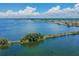 Aerial view of waterfront property with lush vegetation and homes at 5915 Sea Ranch Dr # 308W, Hudson, FL 34667
