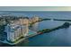 Aerial view of waterfront condos with pool and tennis courts at 5915 Sea Ranch Dr # 308W, Hudson, FL 34667