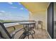 Balcony with table and chairs offering scenic water views at 5915 Sea Ranch Dr # 308W, Hudson, FL 34667