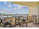 Enjoy water views from this balcony, furnished with a small table and chairs at 5915 Sea Ranch Dr # 308W, Hudson, FL 34667