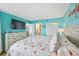 Bright bedroom with a king-size bed and flamingo bedding at 5915 Sea Ranch Dr # 308W, Hudson, FL 34667