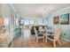 Condo dining area; glass table with white chairs and ocean view at 5915 Sea Ranch Dr # 308W, Hudson, FL 34667