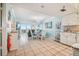 Kitchen and dining area with white cabinets and table at 5915 Sea Ranch Dr # 308W, Hudson, FL 34667