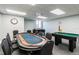 Game room with poker table, foosball, and pool table at 5915 Sea Ranch Dr # 308W, Hudson, FL 34667