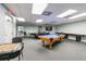 Community game room with pool table, ping pong, and seating at 5915 Sea Ranch Dr # 308W, Hudson, FL 34667