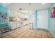 Bright condo kitchen, granite counters, white cabinets, and flamingo decor at 5915 Sea Ranch Dr # 308W, Hudson, FL 34667
