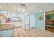 Condo kitchen featuring granite countertops and white cabinetry at 5915 Sea Ranch Dr # 308W, Hudson, FL 34667