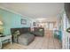 Spacious living area featuring a sectional sofa and view into dining area at 5915 Sea Ranch Dr # 308W, Hudson, FL 34667