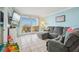 Relaxing living room with comfortable sectional sofa and access to balcony at 5915 Sea Ranch Dr # 308W, Hudson, FL 34667
