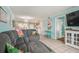 Gray sectional sofa dominates this living room, offering ample seating at 5915 Sea Ranch Dr # 308W, Hudson, FL 34667