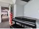 Small room with piano and American flag at 5915 Sea Ranch Dr # 308W, Hudson, FL 34667