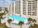Aerial view of community pool and building at 5915 Sea Ranch Dr # 308W, Hudson, FL 34667