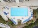 Overhead view of refreshing pool with ample lounge chairs at 5915 Sea Ranch Dr # 308W, Hudson, FL 34667