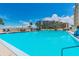 Relaxing community pool area with comfortable seating and a view at 5915 Sea Ranch Dr # 308W, Hudson, FL 34667