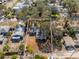 Aerial view of a single-Gathering home with a yard, located in a residential neighborhood at 6923 Dartmouth N Ave, St Petersburg, FL 33710