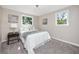 Cozy bedroom with a double bed and two windows at 6923 Dartmouth N Ave, St Petersburg, FL 33710