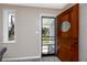 Front door with a screen door, offering natural light into the home at 6923 Dartmouth N Ave, St Petersburg, FL 33710