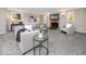 Bright living room featuring a stone fireplace and ample natural light at 6923 Dartmouth N Ave, St Petersburg, FL 33710