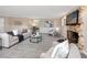 Living room with stone fireplace and comfy seating area at 6923 Dartmouth N Ave, St Petersburg, FL 33710