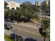 Aerial view showcasing a tree-lined street and city buildings at 700 Beach Ne Dr # 401, St Petersburg, FL 33701