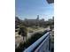 Balcony view of a tree-lined street and city buildings at 700 Beach Ne Dr # 401, St Petersburg, FL 33701