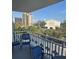 Balcony view of a tree-lined street and city buildings at 700 Beach Ne Dr # 401, St Petersburg, FL 33701